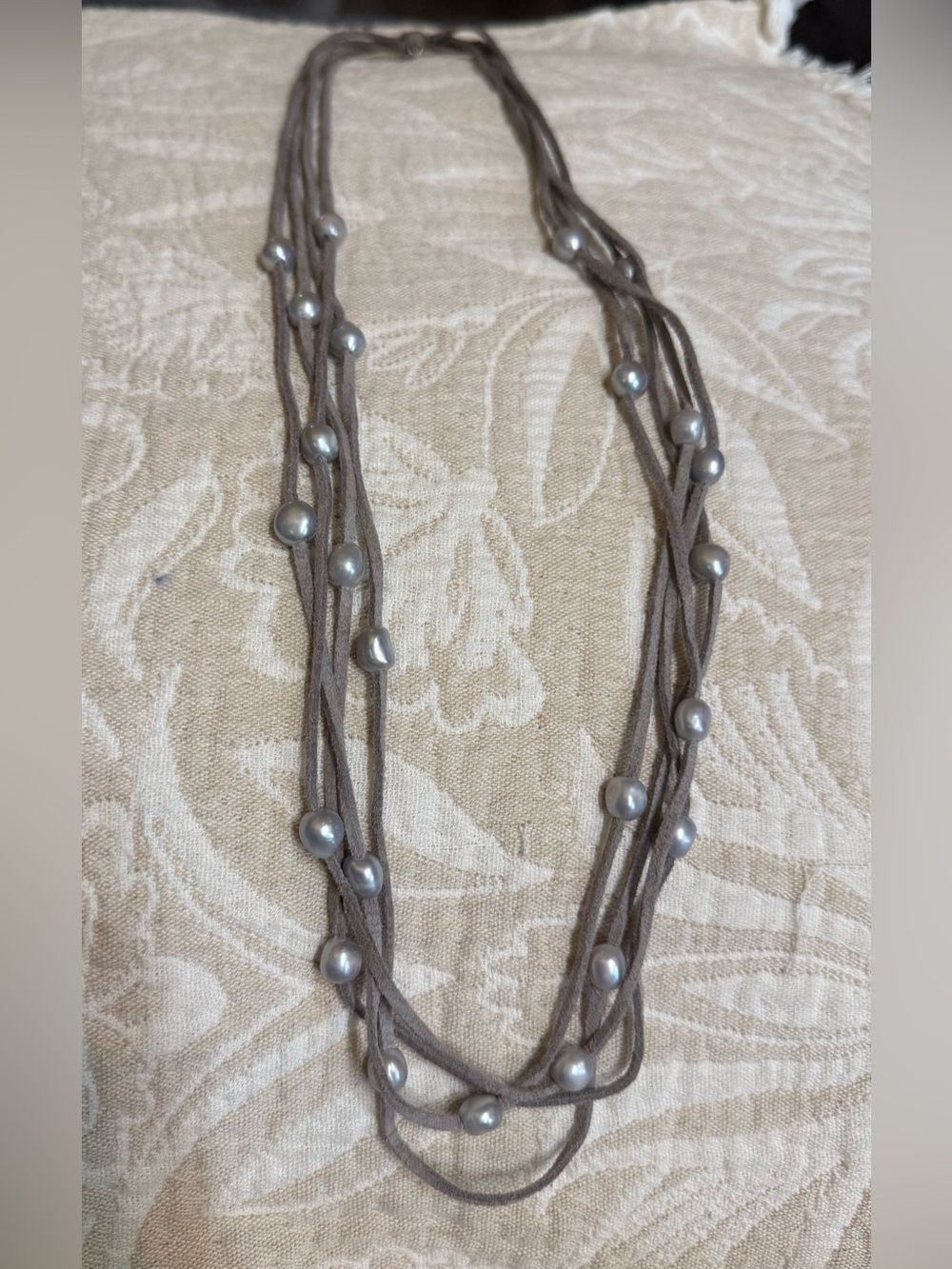 Gray Suede Cord Pearl Necklace. Multi strands are pull over head. Nice